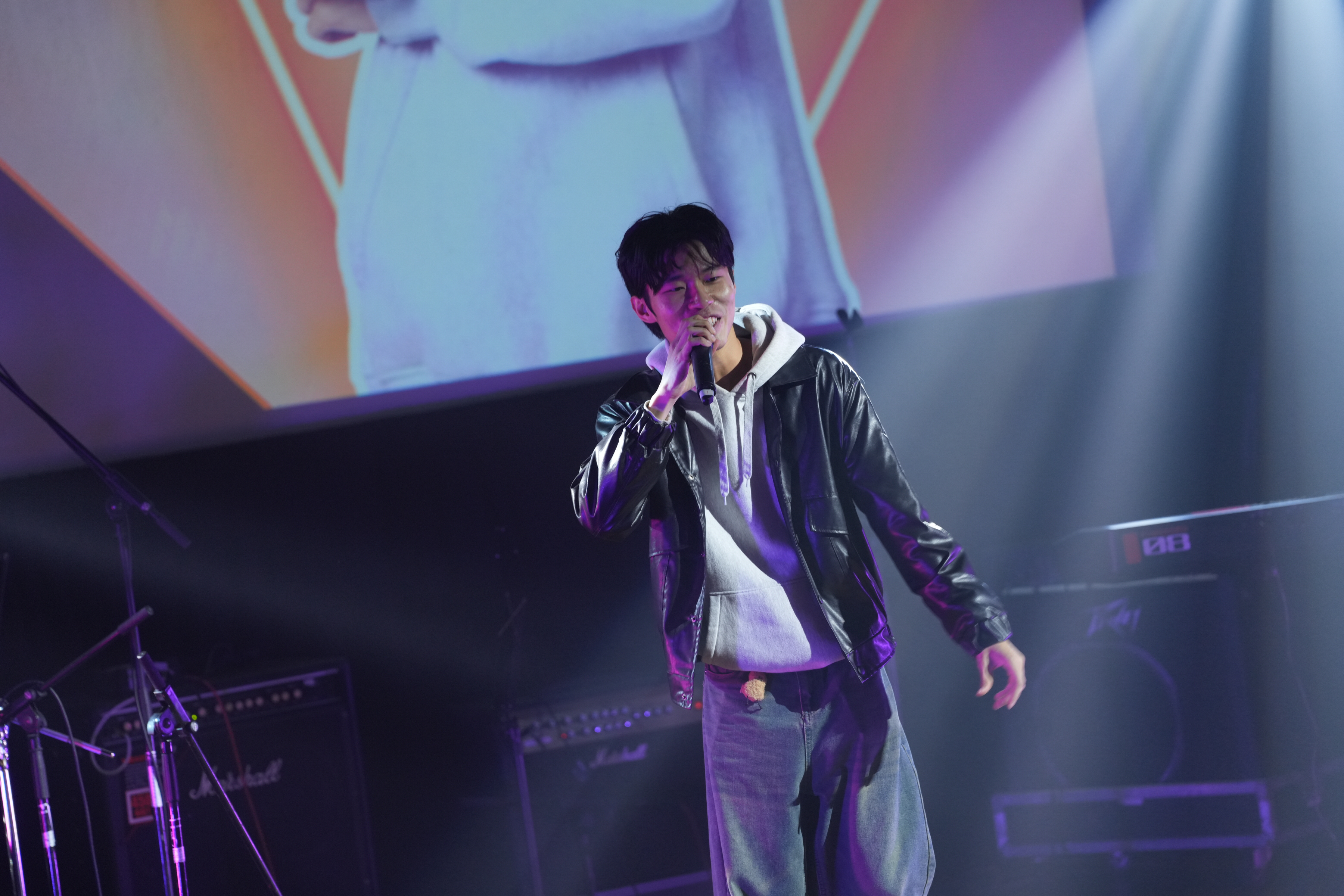 Junoz singing live on stage